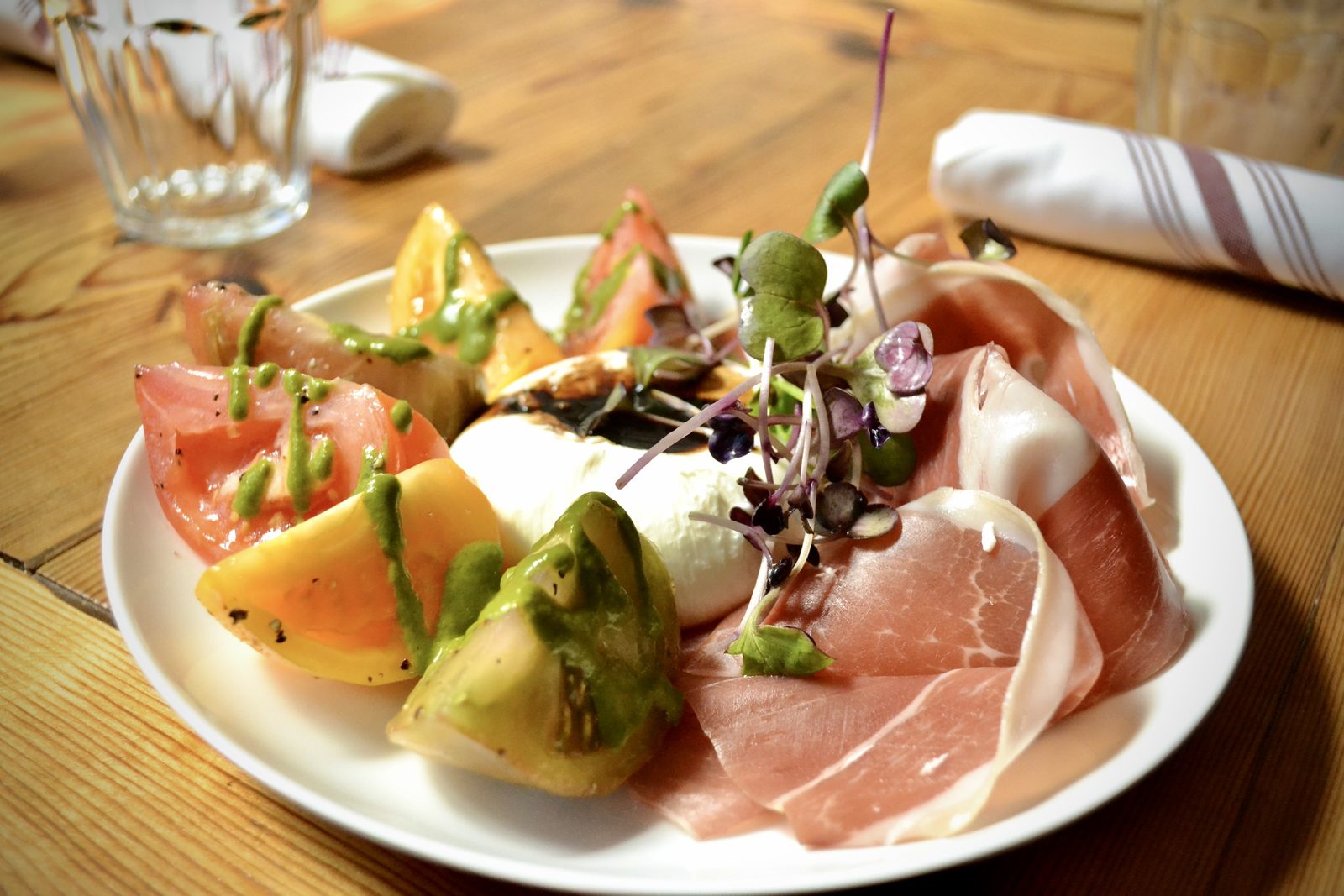 Caprese with prosciutto and heirloom tomato